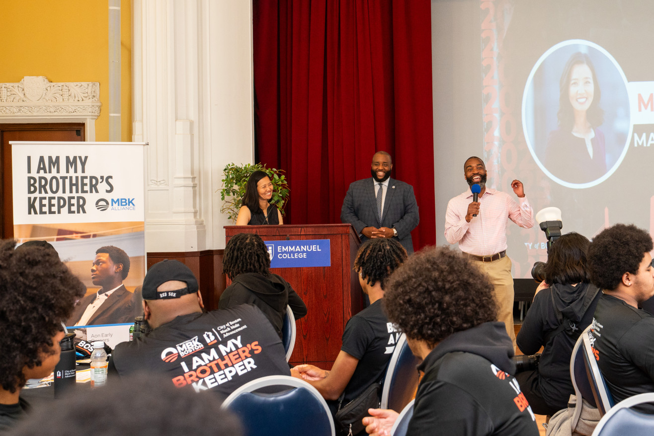 Mayor Michelle Wu at the podium in the Emmanuel auditorium