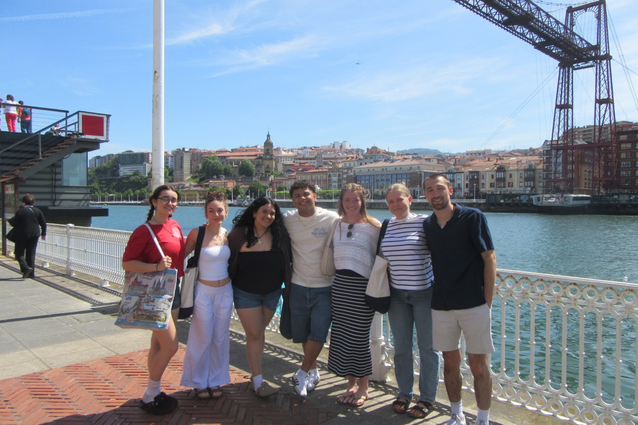 Students from travel course in Bilbao photographed by the water