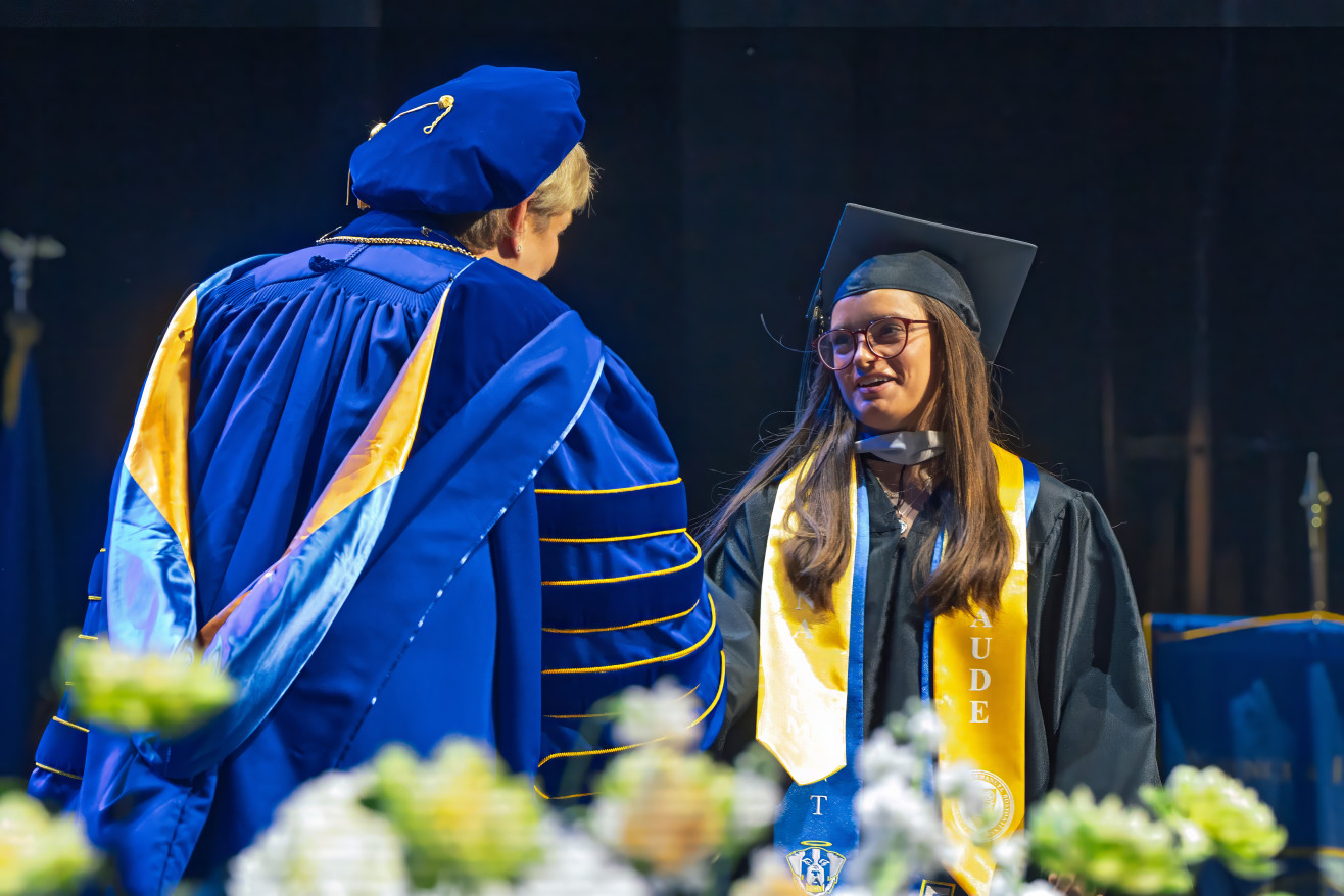 President Beth ross confers a degree 